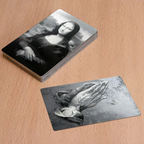Set of 10 laser-engraved metal business cards by Kombis, showcasing sleek design and detailed craftsmanship.