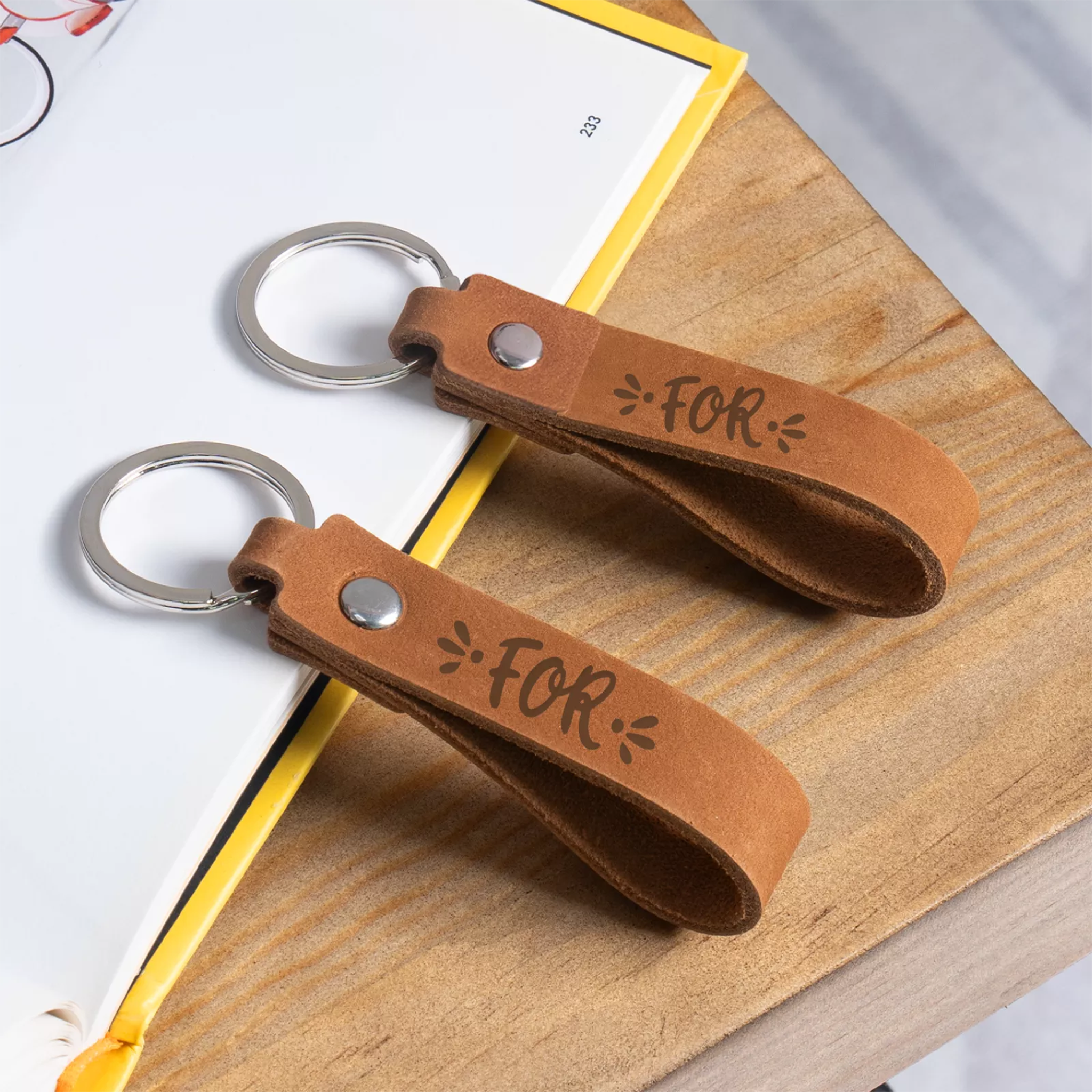 Kombis brown genuine leather keychain with laser-engraved design, slim and stylish key holder for gifts and accessories.