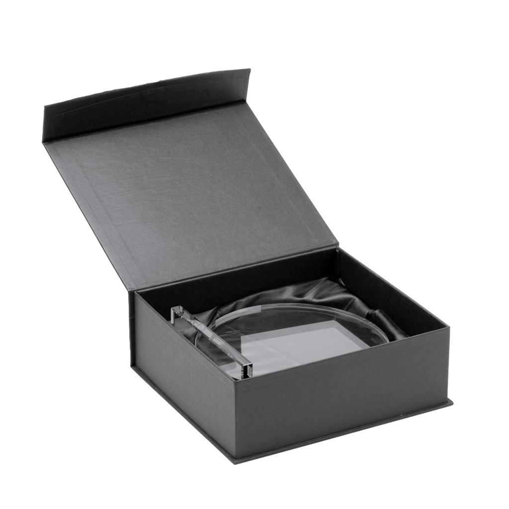 Kombis brand exclusive round glass award with laser engraving, showcasing a sleek, clear design suitable for recognition or gift.